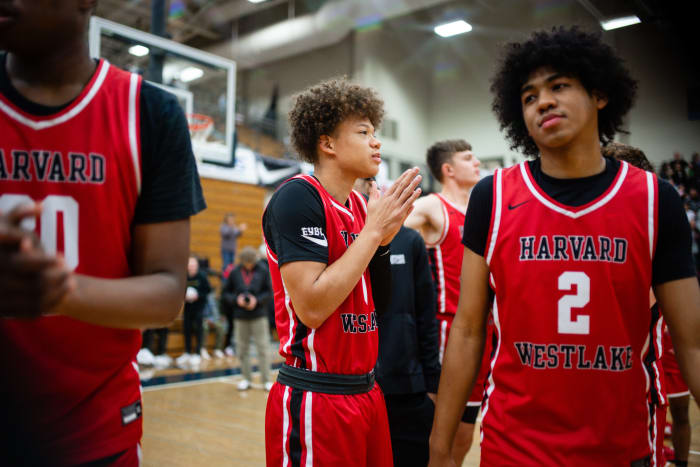Harvard-Westlake senior Trent Perry (center) takes the court at the Les Schwab Invitational championship game on Dec. 30, 2023.